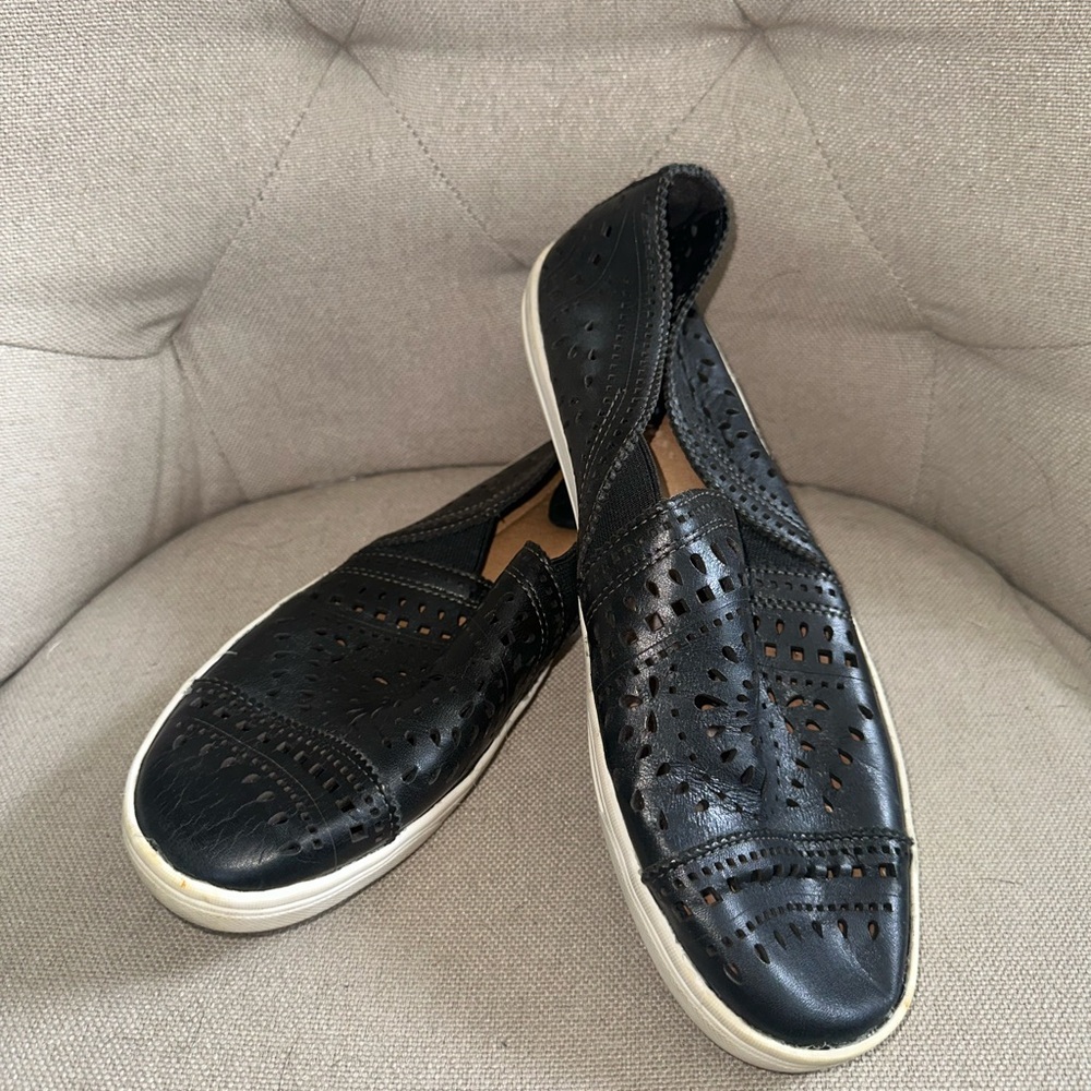 Earth black slip ons